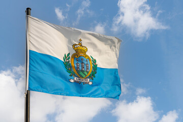 Flag of the Republic of San Marino against a blue sky, San Marino, Europe