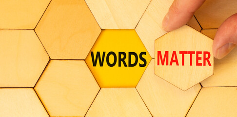 Words matter symbol. Concept word Words matter on beautiful wooden puzzles. Businessman's hand....