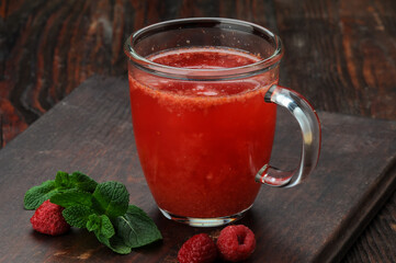 raspberry tea on a brown background macro