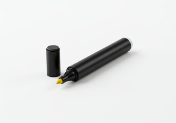 A black marker, cap off, reveals a yellow tip, resting on a white surface, showcasing the tool's simplicity and functionality