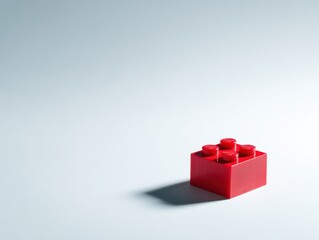 Obraz premium Bright Red Plastic Block on Minimal Background