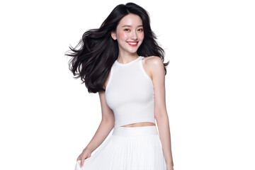 Studio shot of a beautiful young woman with long, dark, windswept hair, wearing a stylish white top and skirt, smiling at camera