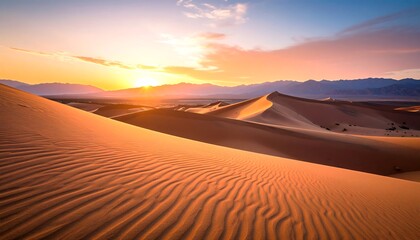 A breathtaking sunrise paints the desert dunes with warm, golden hues, casting a serene and peaceful atmosphere over the landscape.
