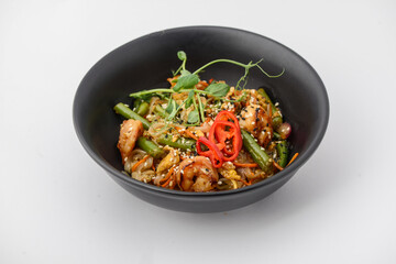 noodles with chicken, microgreens and pepper on a white background macro