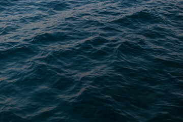 Obraz premium Clear water with waves in the sea. Ocean wallpaper. Ripples