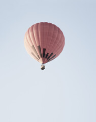 Hot air balloon flies in the sky