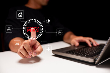 A person activates an emergency plan feature on a digital interface, emphasizing preparedness and...