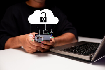 A person holds a smartphone, with a digital cloud icon representing data security and privacy,...
