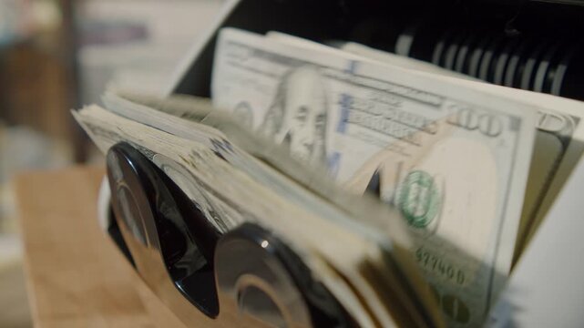 Efficient money counting machine handles bulk paper currency for businesses, banks, and trade institutions, showcasing seamless workflow in income management and capital investment services.