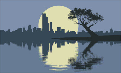 Fototapeta premium Serene cityscape silhouette with a prominent moonlit tree reflected in calm water