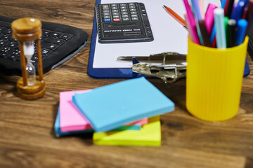 Workplace Essentials with Office Supplies on Wooden Desk Surface