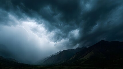 Dramatic thunderstorm approaching a mountain valley
