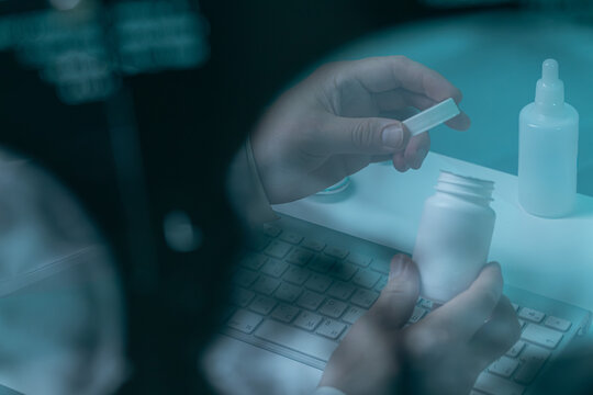 Doctor opening pill bottle through genetic scan overlay
