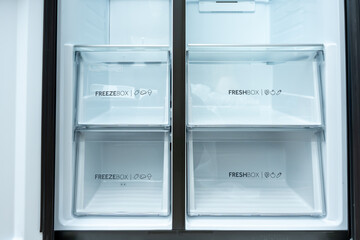 Detailed view of the lower drawers of the refrigerator with FreezeBox and FreshBox. Ideal for meat,...