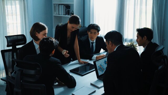 Top view of diverse business people brainstorm marketing idea while marketing team analyst stock market investment. Group of skilled project manager solving problems and sharing plan. Directorate. - Powered by Adobe