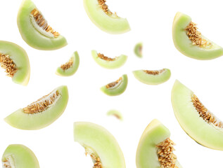 Cut fresh ripe melons swirling in air against white background