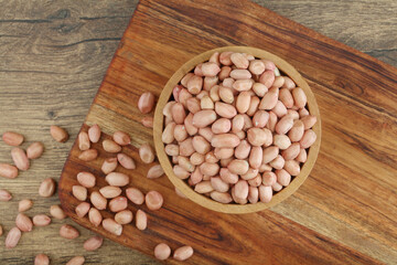 Fresh peanuts in wooden bowl,Close up