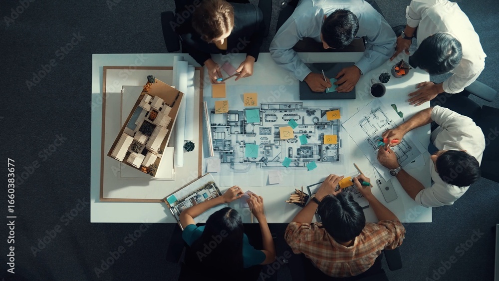 Poster top aerial view of project manager or civil engineer writing at blueprint and planning building desi