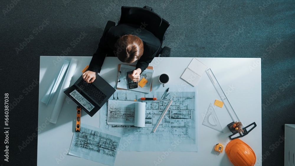 Poster architect engineer working while working on laptop with sticky notes and calculator to design buildi