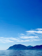 Coastal Mountain Vista Under Azure Sky