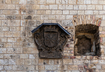 Stone coat of arms on wall in Prague Castle in the Prague in the Czech Republic