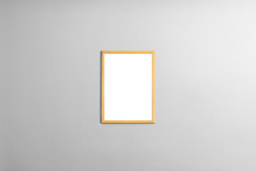 Modern minimal interior with one two three  four  five blank wooden photo frames light gray wall,...