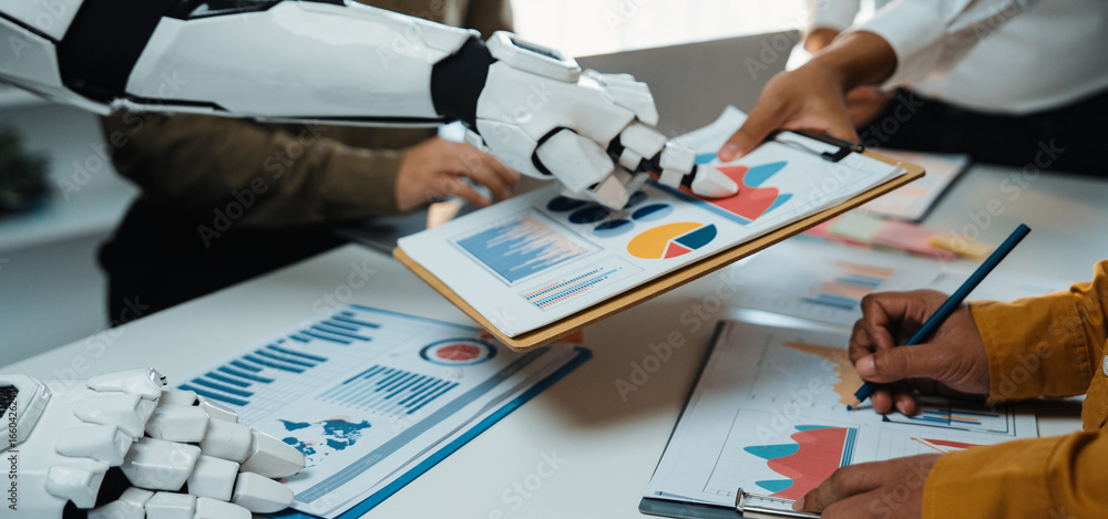 Poster a futuristic office scene showcasing collaboration between a robot and humans. they analyze data cha