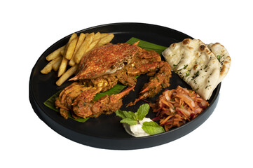 Indian-style Tawa Crab Masala on banana leaf, served with crispy fries, soft kulchas, fresh salad, and tangy dip, isolated on transparent background.