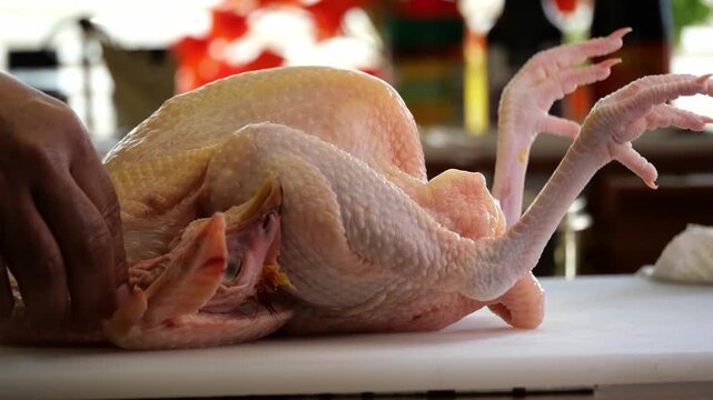 whole rooster chicken on the table