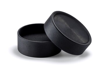 Sleek modern black cylindrical container with textured lid, perfect for luxury packaging or product display.