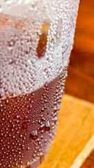 Chilled Beverage Bliss: A refreshing cold beverage with condensation on the glass, showcasing tiny...