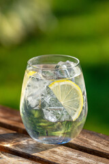 glass of water with ice and lemon