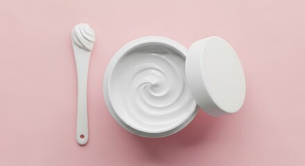 Cosmetic cream jar and spoon on pink background