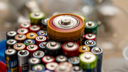 A lot of different used batteries close-up.