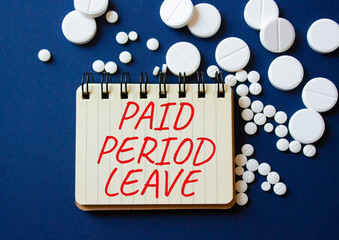 Paid Period Leave symbol. Concept words Paid Period Leave on notebook. Beautiful deep blue...