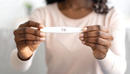 Woman holding pregnancy test (1)