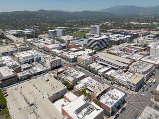 Pasadena, CA, California, LA County, May 19, 2025: Aerial Top View of Pasadena Downtown Colorado Blvd including Streets, Buildings, Shops, Mountain
