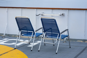 Empty chairs on the deck of a cruise ship 