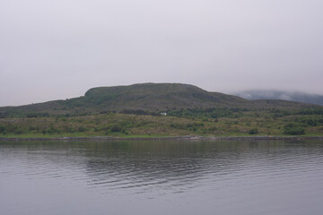 Landscape of a mountain with a small cabin in front 
