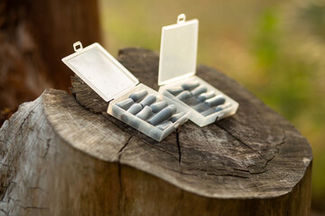 Close-up of white suppositories in blister packaging. Pharmaceutical product for healthcare and...