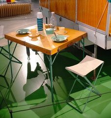 Camping table and chairs with cutlery