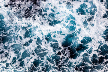 Sea water surface background. Aerial view of amazing foamy water. Can be used in covers, packaging,...