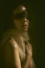 woman with her hair covering her eyes in a romantic attitude