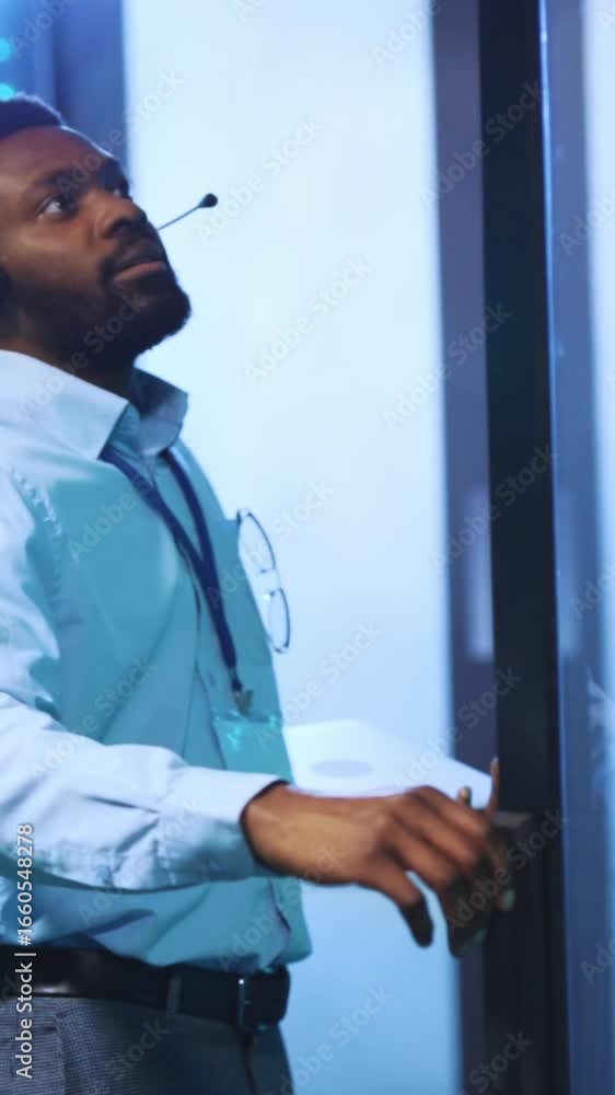 Poster a professional wearing a headset while working in a modern office environment setup