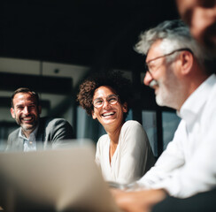Diverse happy corporate teamwork and training, high achievers, winning team, professionals, at work, in office setting. Themes of community, success, productivity and connection. CEO and team
