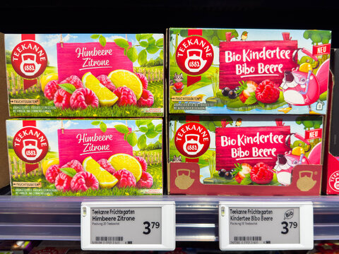 Villach, Austria - August 21, 2025: Teekanne fruit tea boxes featuring raspberry lemon and Bibo Berry flavors on supermarket shelf, showcasing vibrant packaging and appealing design elements