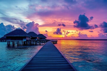 Obraz premium Romantic Sunset Over Maldives: Tranquil Sky and Water Villas with Wooden Pier, Perfect for Rest and Relaxation