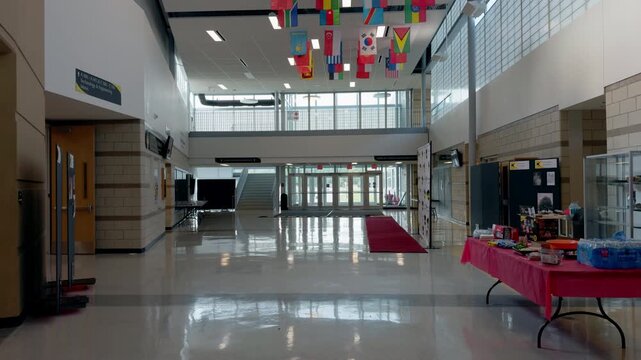 The empty hall and entrance or exit of an American school. Internal view of educational building.