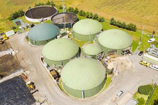 Biogas plant and farm in green fields. Renewable energy from biomass. Modern agriculture in Czech Republic and European Union.	
