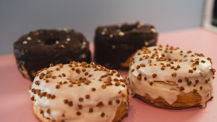 A vibrant selection of assorted donuts with various toppings and glazes, perfect for bakeries,...